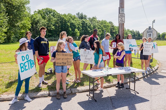Students demonstrate near the entry to Rice Memorial High School in South Burlington. - OLIVER PARINI