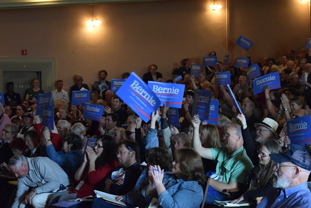 Vermont Democratic state convention delegates wave Bernie Sanders placards. - TERRI HALLENBECK