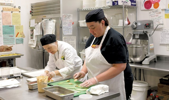 Chef-instructor Robin Burnett (left) and participant Stacey Clarke in the Vermont Works for Women Fresh Food Enterprise training program in 2015 - COURTESY OF VERMONT WORKS FOR WOMEN