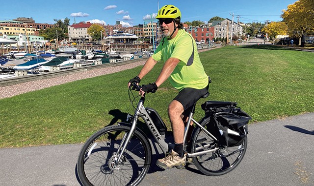 Ken Picard on a Local Motion e-bike on the Burlington Greenway - JEFF BARON ©️ SEVEN DAYS