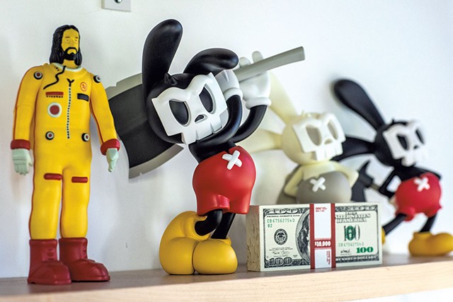 A shelf in Paul Budnitz's office, holding Guggimon and other Superplastic toys - LUKE AWTRY