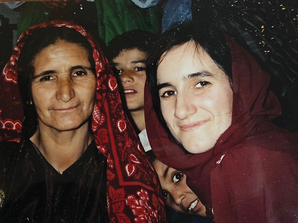 Tracy Dolan (right) in Takhar Province, Afghanistan, in 2002 - COURTESY OF TRACY DOLAN