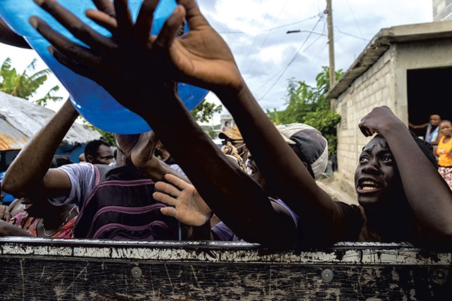 People waiting at the water distribution  in southwest Haiti - JAMES BUCK