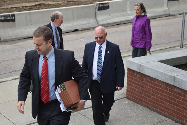 Defense attorney Brooks McArthur and Sen. Norm McAllister arrive at court Monday in St. Albans. - TERRI HALLENBECK