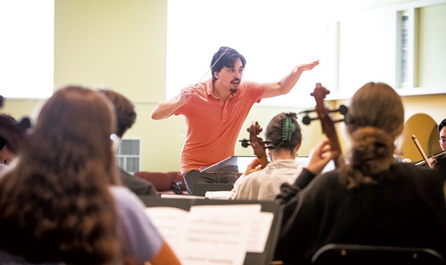 Mark Alpizar conducting the VYO during an August rehearsal, before masking guidance changed - CAT CUTILLO