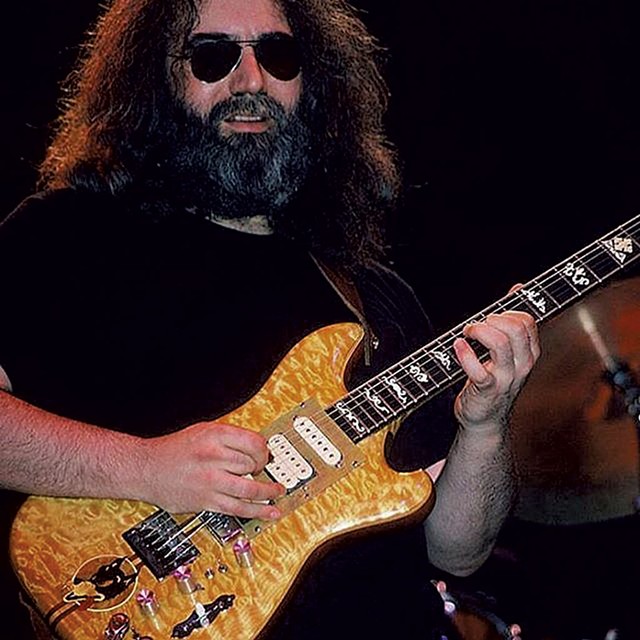 Jerry Garcia playing his "Wolf Guitar" in 1978 - COURTESY OF AM DEW PHOTOS