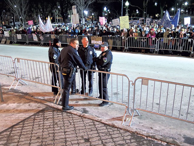 Brandon del Pozo with officers outside of the Flynn Center for the Performing Arts during Donald Trump's rally in January 2016