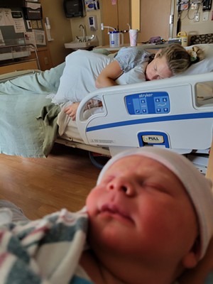 Corey Barrows and her newborn son - DEREK BARROWS