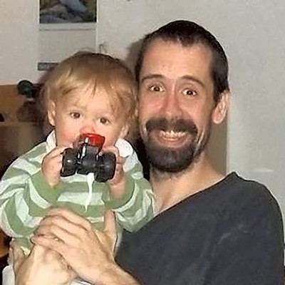 Michael Cornell with one of his children - COURTESY
