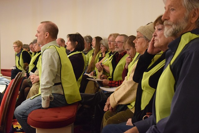 Opponents of wind projects wearing distinctive identifying vests at the last legislative session at the Statehouse. - TERRI HALLENBECK