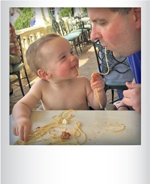 Joe Victory and son, Jackson, slurping pasta at Disney World in March, 2015. Submitted by Sara Victory, Winooski