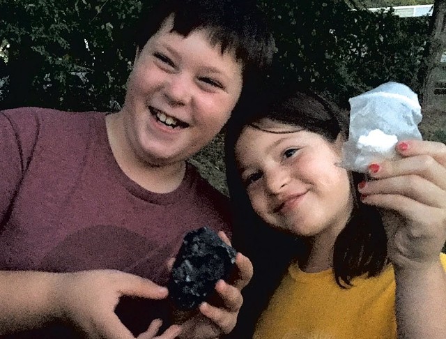 Graham and Ivy with the cache and paper log they found - CATHY RESMER