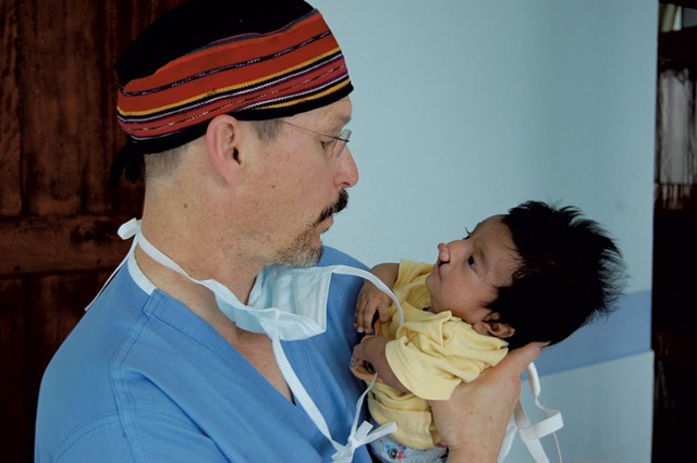 Dr. Donald Laub with an overseas patient - COURTESY OF DR. LAUB