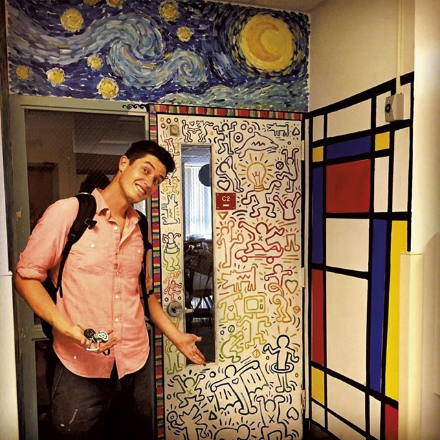 Pete Boardman in front of his classroom door