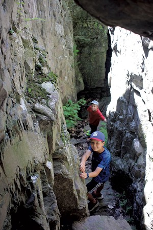 A deep, narrow cave makes for a perfect climbing spot - HEATHER FITZGERALD