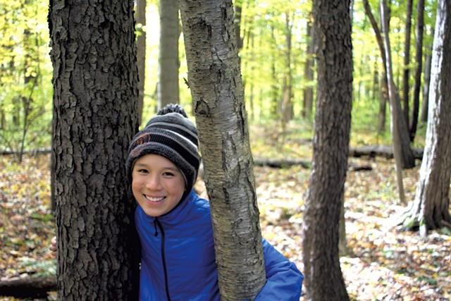 Jesse with a black cherry tree, left, and yellow birch tree, right - HEATHER FITZGERALD