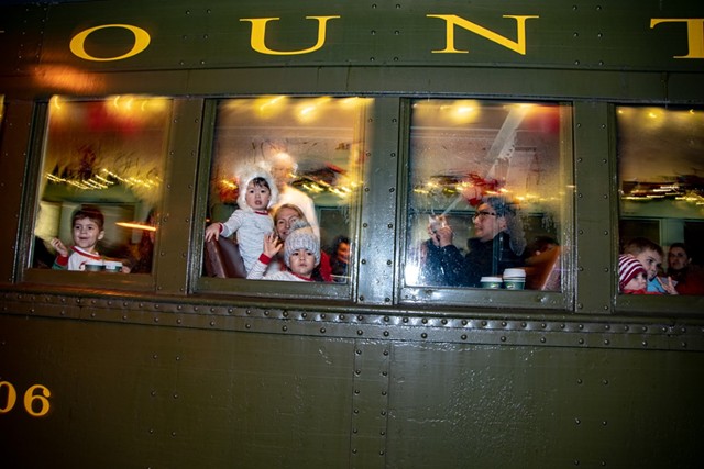 Children look out the train window during the Polar Express in 2018 - COURTESY OF VERMONT CHILDREN'S TRUST FOUNDATION