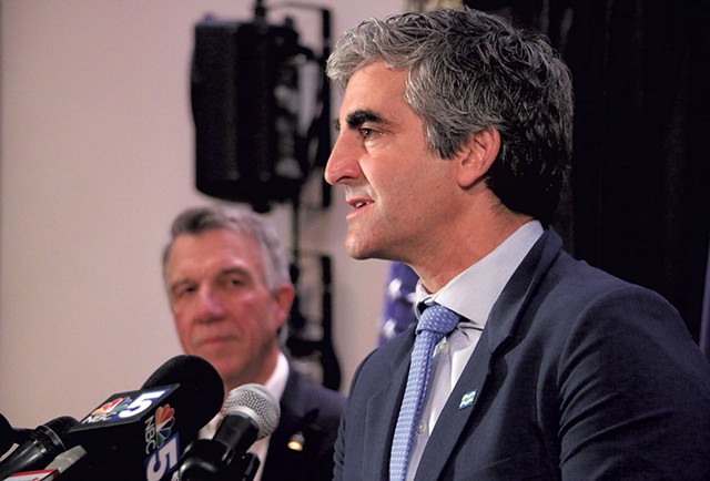 Burlington Mayor Miro Weinberger speaking at Tuesday's press conference as Gov. Phil Scott looks on - KEVIN MCCALLUM ©️ SEVEN DAYS