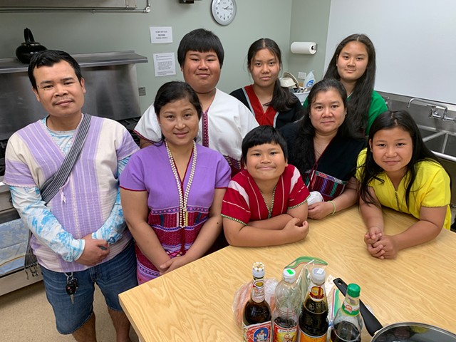 Lead fundraiser cooks Thalei Paw (second from left) and Kee Lar (second from right) with their families - MELISSA PASANEN.