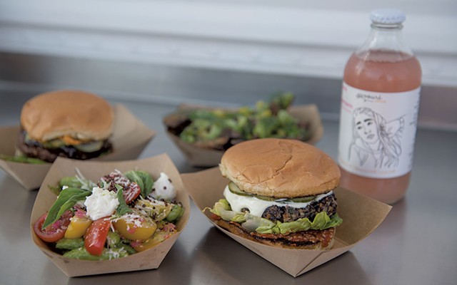 Clockwise from bottom left: Snap pea salad, barbecue falafel burger, crispy potatoes and veggie burger from Mister Foods Fancy - DARIA BISHOP