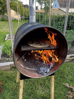 Tarte flamb&eacute;e baking in a WoodFyred oven - MELISSA PASANEN