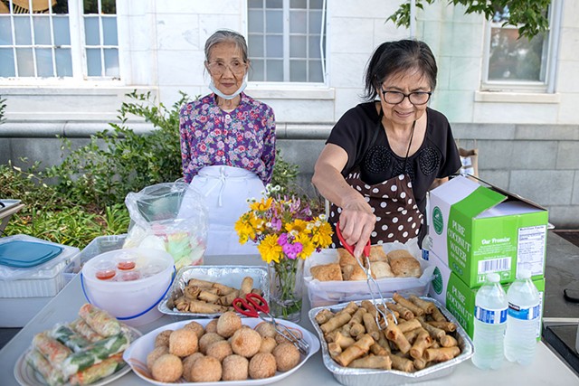 La Trinh (left) and Hue Tran at the Vietnamese Community Group food stand - DARIA BISHOP