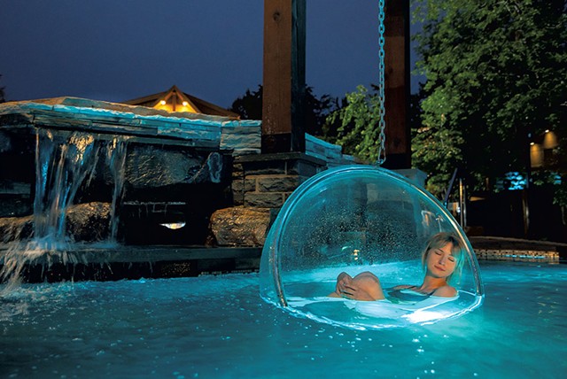 "Helsinki bubbles" floating in an outdoor hot pool at Spa Le Finlandais - COURTESY OFSPA LE FINLANDAIS