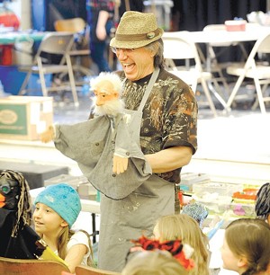 Dan Baginski instructs students on how to use their puppets