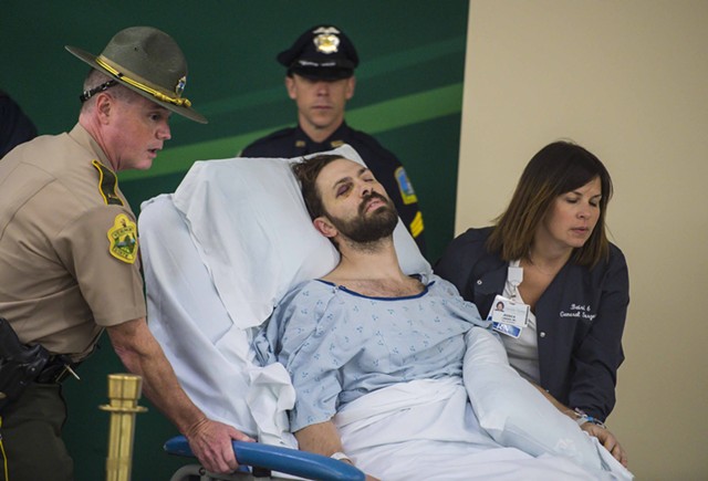 Steven Bourgoin being wheeled into his arraignment at the UVM Medical Center last week - FILE: GLENN RUSSELL/BURLINGTON FREE PRESS