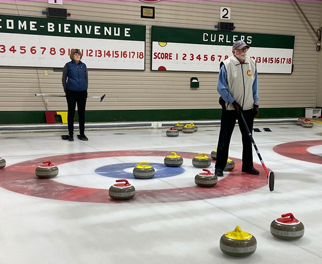 Charles Goulding setting a target as Faye Tolar looks on at the Border Curling Club - ERIK ESCKILSEN