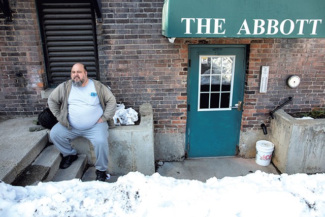 Former hotel resident Michael Hutchins outside the Brattleboro building where he lives - ZACHARY P. STEPHENS