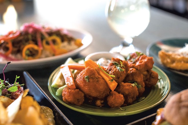 An array of dishes at Despacito Bar and Kitchen, including Buffalo cauliflower - LUKE AWTRY