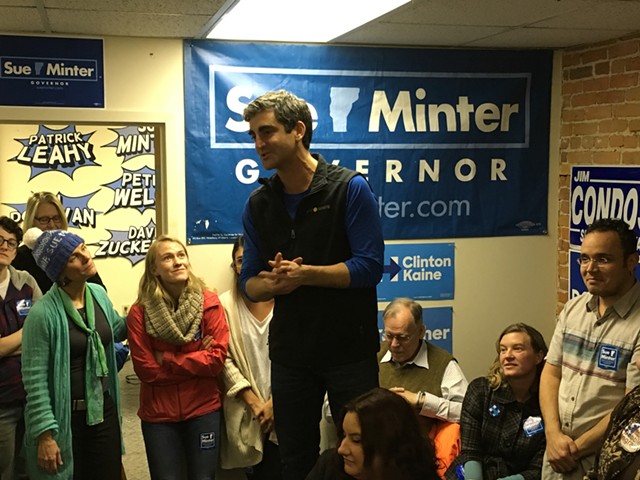 Sue Minter, left, looks on as Burlington Mayor Miro Weinberger addresses volunteers at the Vermont Democratic Party's Burlington office. - PAUL HEINTZ