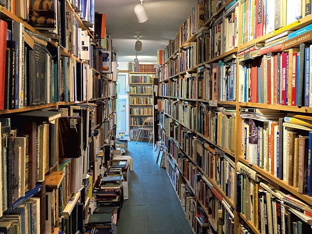 An aisle of books at the Country Bookshop - SALLY POLLAK