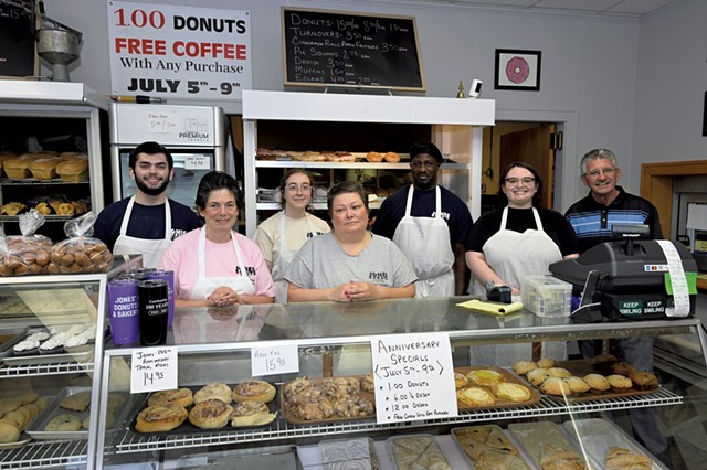 Owners Lynn (in pink) and Walt Manney (far right) with Jones' Donuts staff - JON OLENDER