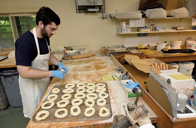 Ethan Hall shaping doughnuts - JON OLENDER