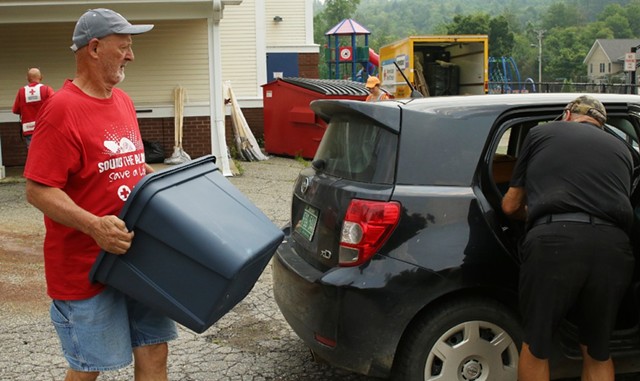 Red Cross volunteers loading supplies - COURTNEY LAMDIN ©️ SEVEN DAYS