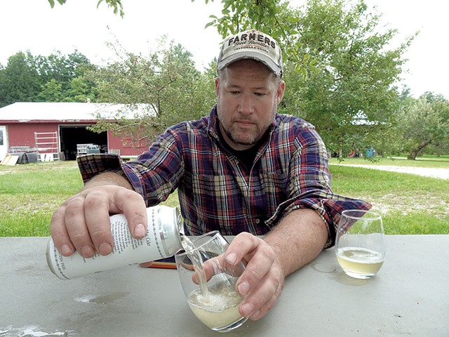Conor McManus pouring his Mountain Mac hard cider at Happy Valley Orchard - RACHEL MULLIS