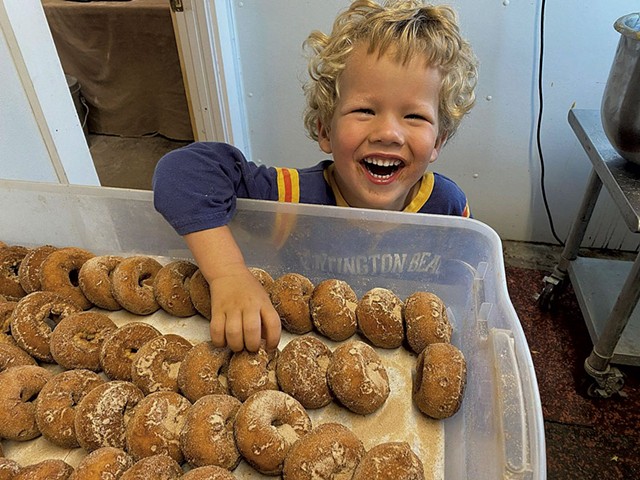 Henry McManus with cider doughnuts at Happy Valley Orchard - COURTESY