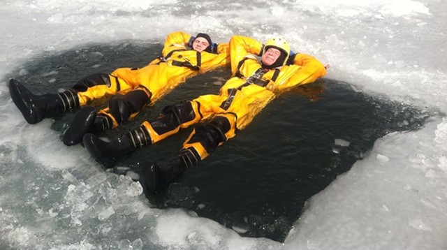 Harty, right, soaking in a “Vermont hot tub” as he taught an ice rescue class. - COURTESY OF TOM HARTY