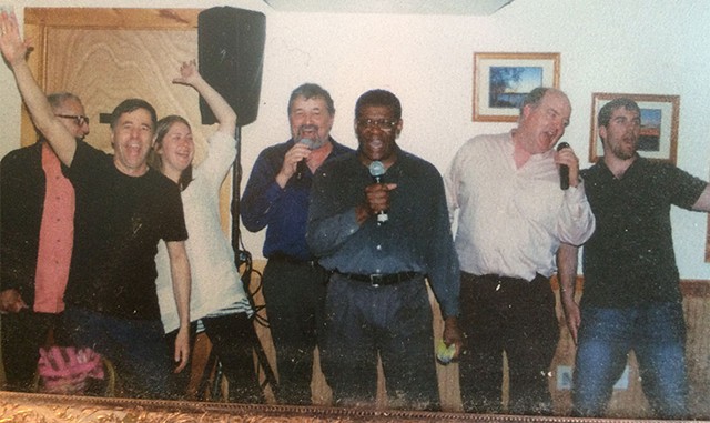 Glenn (center) singing at Rich Graham's (with arm raised) birthday in 2008 - COURTESY OF RICH GRAHAM