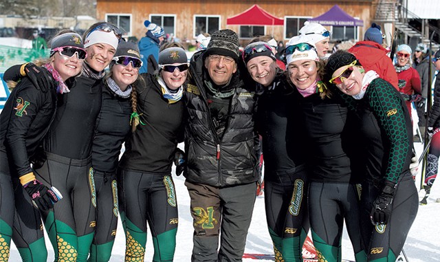 Fred Fayette Jr. with the University of Vermont women's Nordic ski team - COURTESY