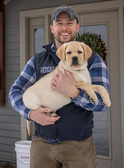 Vermont Frames owner Kevin Moyer and his dog Theo - JAMES BUCK