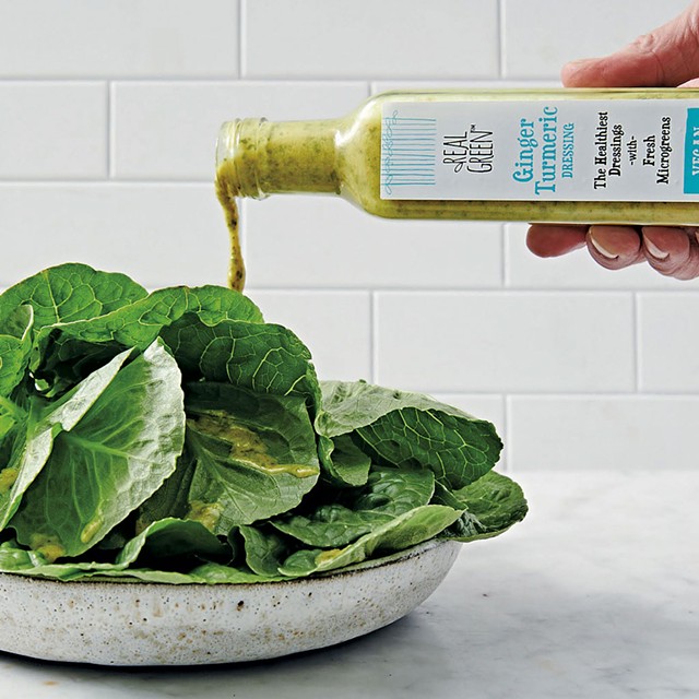 Real Green Foods' Ginger Turmeric dressing on greens - COURTESY