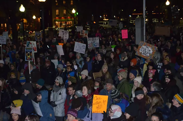Hundreds Brave Cold to Protest Trump at Burlington Rally