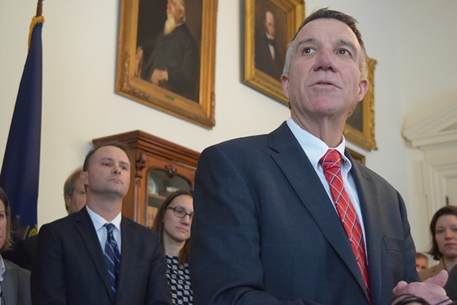 Gov. Phil Scott speaks Thursday about a bill to defy President Donald Trump’s immigration order as Attorney General T.J. Donovan and others listen. - TERRI HALLENBECK