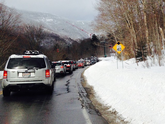Cars sit on Vermont 108 waiting to get into a parking lot at Stowe  Mountain Resort on January 28. - MOLLY WALSH