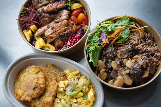 Clockwise from bottom left: Ackee and saltfish with fried green plantains; signature jerk chicken salad; oxtails with rice and peas - DARIA BISHOP