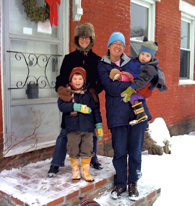 Cathy Resmer and Ann-Elise Johnson with Graham and Ivy Resmer on their doorstep in December 2010 - COURTESY