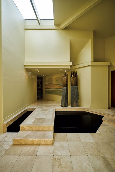 The soothing sounds of a water feature, subtle tones and fine art greet visitors in the foyer. - BEAR CIERI